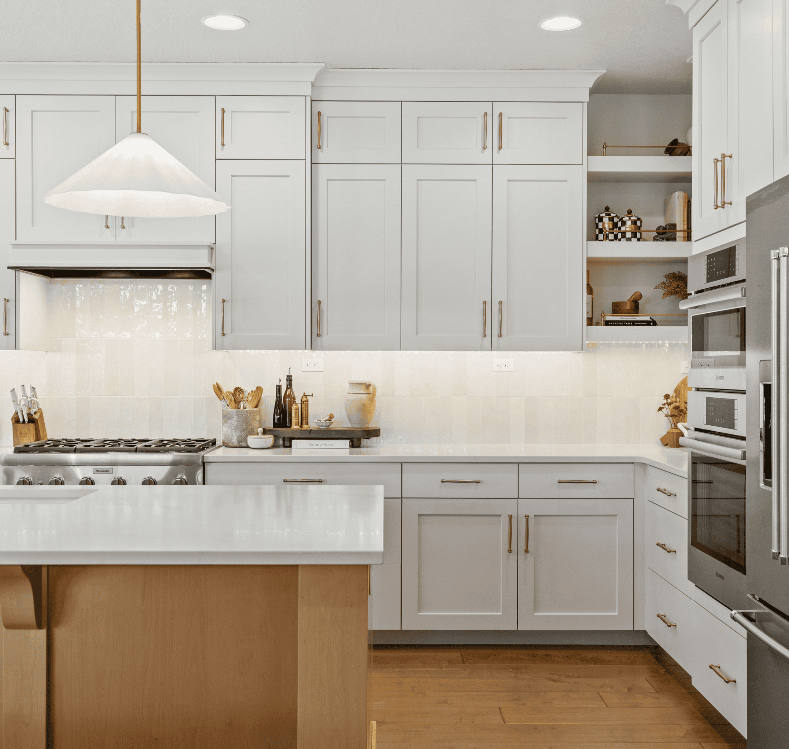 Modern Kitchen Design Bright modern kitchen with white cabinets, stainless steel appliances, and a central island.