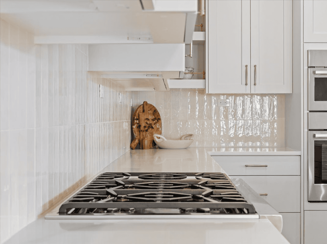 Modern Kitchen Design Bright modern kitchen with white cabinets and stainless steel appliances.