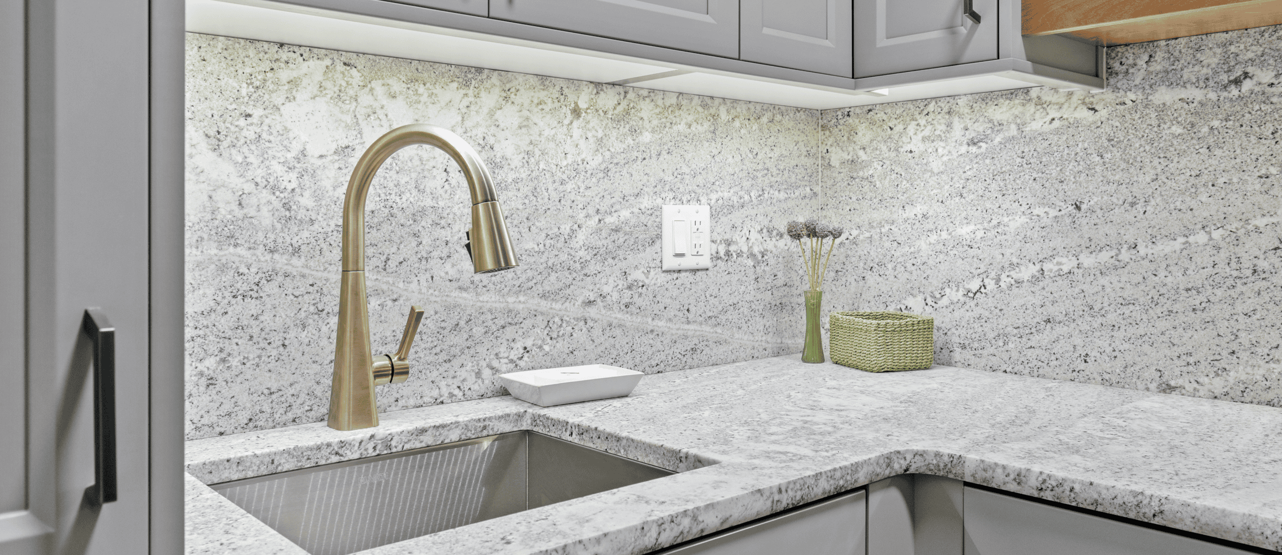 Modern Kitchen Sink Contemporary kitchen sink with gold faucet and granite countertop.